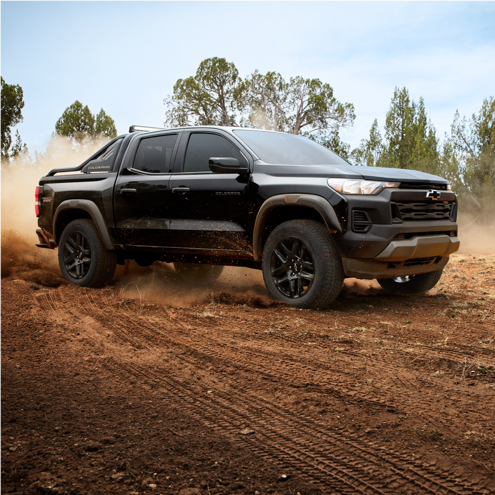 Colorado Trail Boss Driving Down a Dusty Road