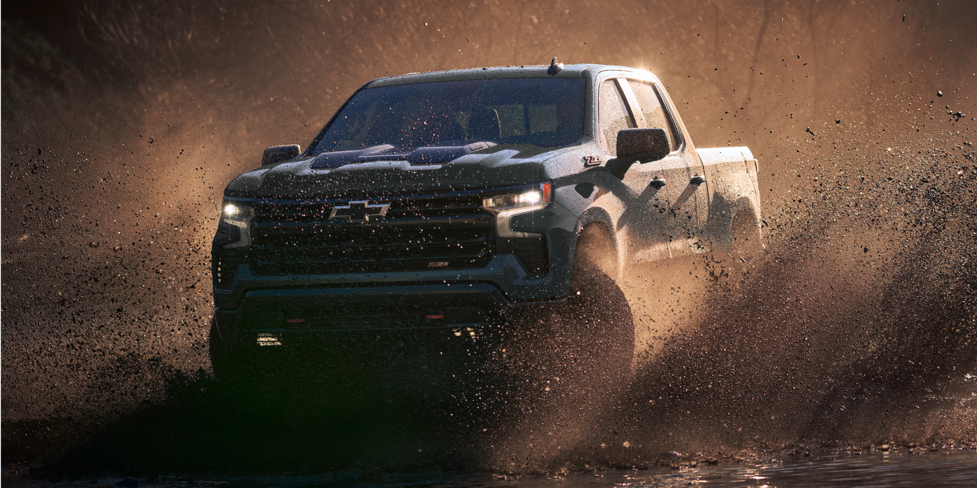 Silverado 1500 Trail Boss Driving Through Mud