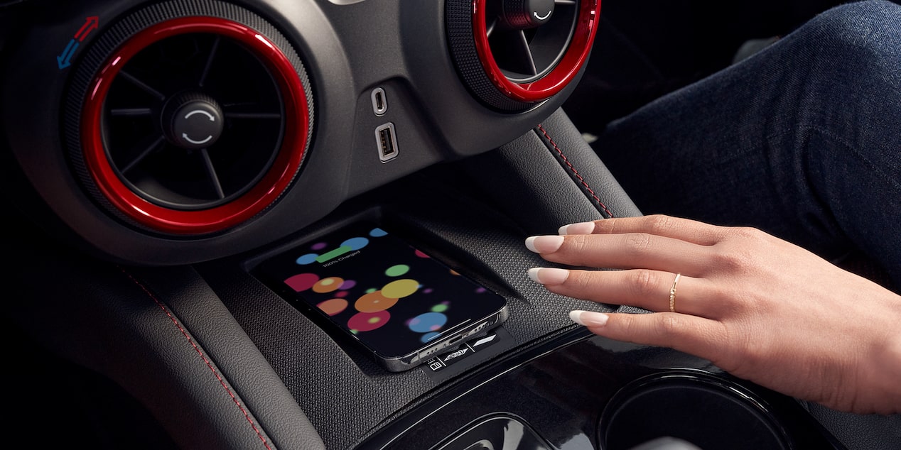 Woman Using Wireless Smart Phone Charging Inside the 2025 Chevy Blazer