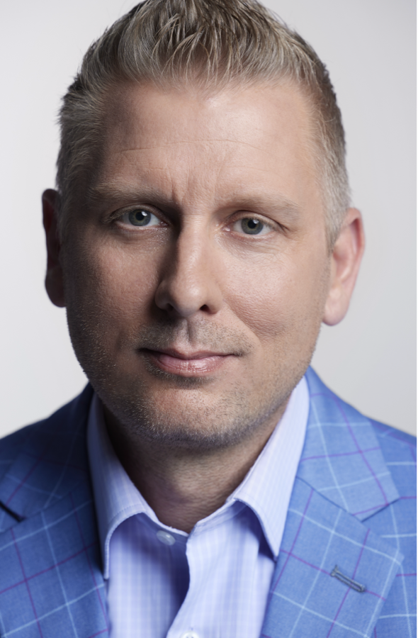 A headshot of Matthew Purdy, chief engineer for battery-elec-tric SUVs at GM.