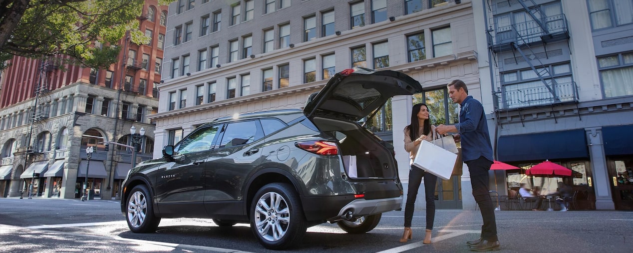 Couple Loading Trunk of SUV