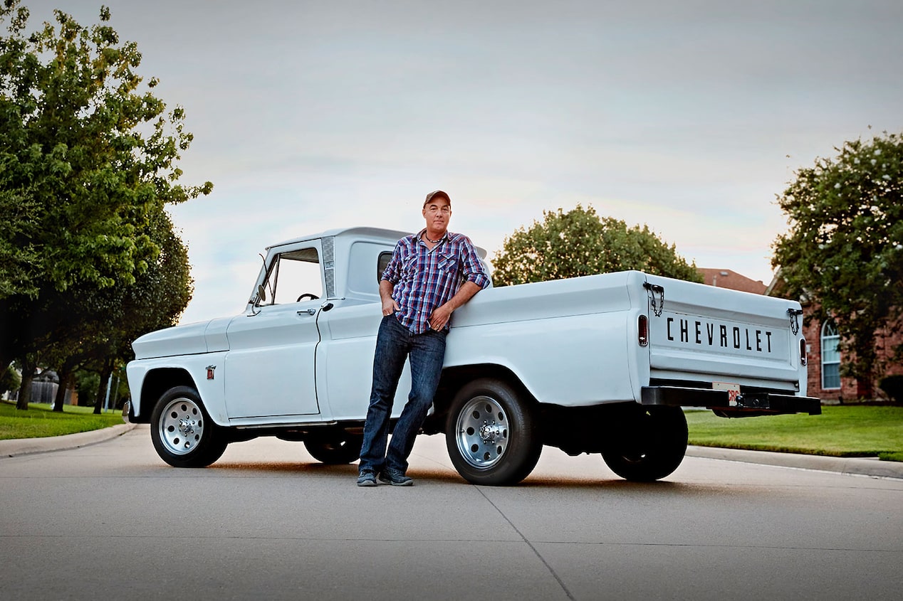 A Man Leaning Against His 1960s Chevy Truck