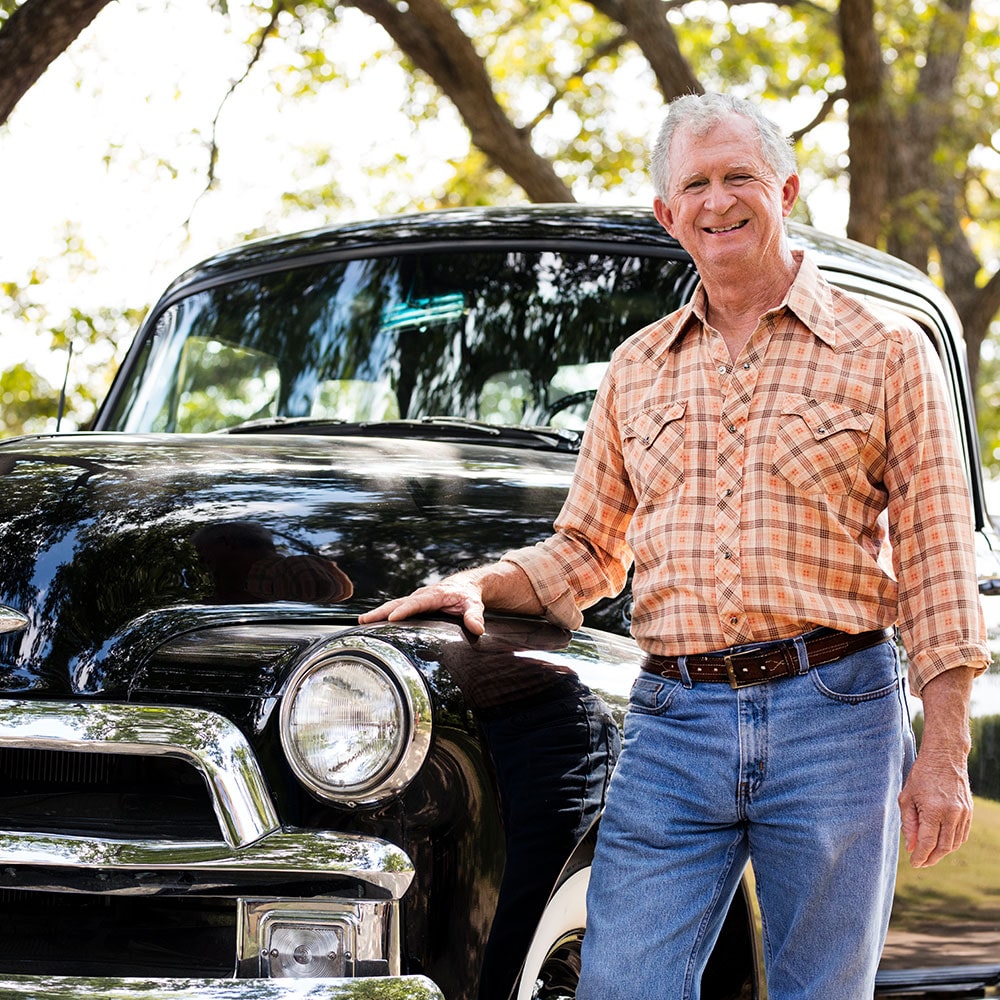 A Man Posing Near the Front of His 1950s Chevy Truck