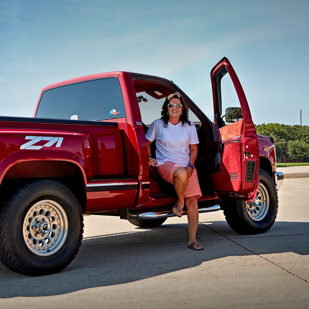 A Woman Sitting on the Passenger Side of Her Chevy Silverado Z71 Truck