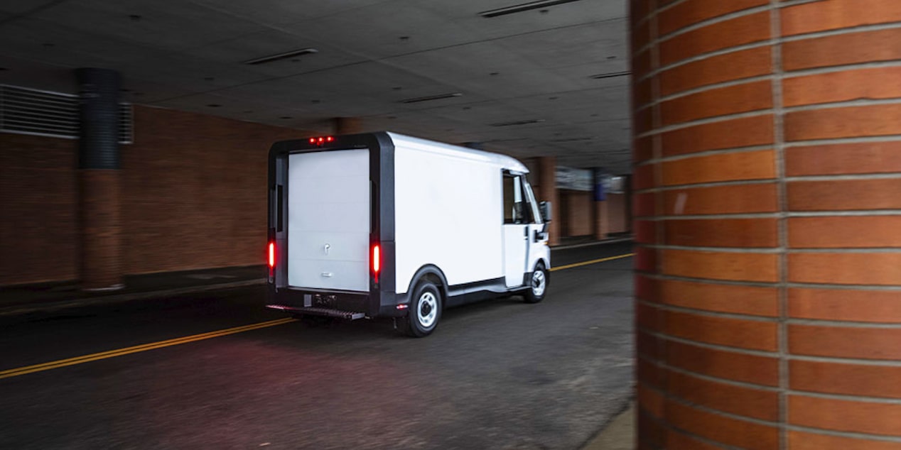 BrightDrop Van Parked in a Loading Zone of a Building