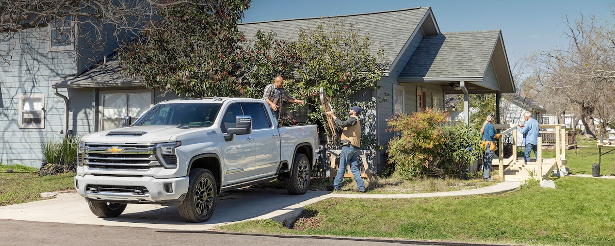Black Chevrolet Diesel Truck Towing Boat
