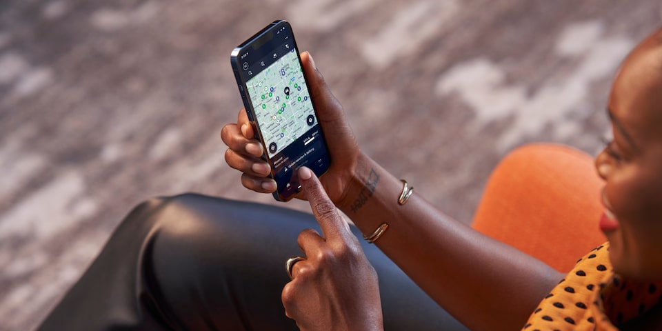 Overhead View of a Woman Using the Chevrolet Mobile App