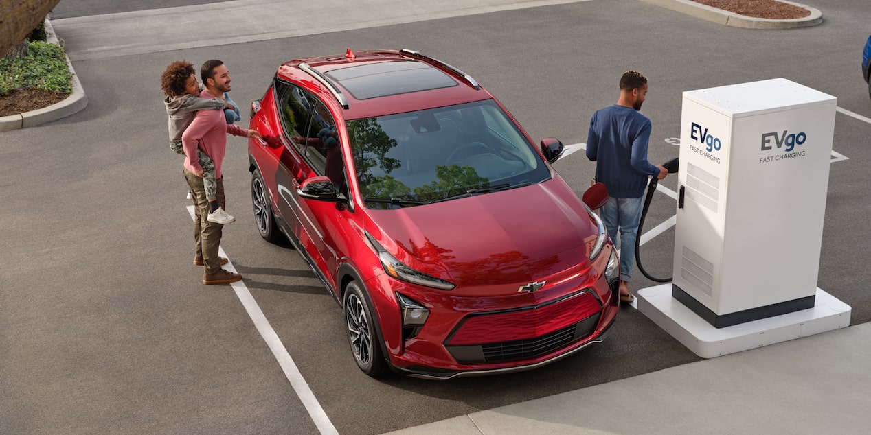 A Family Charging their Chevy Bolt EUV at a Public Charging Station 