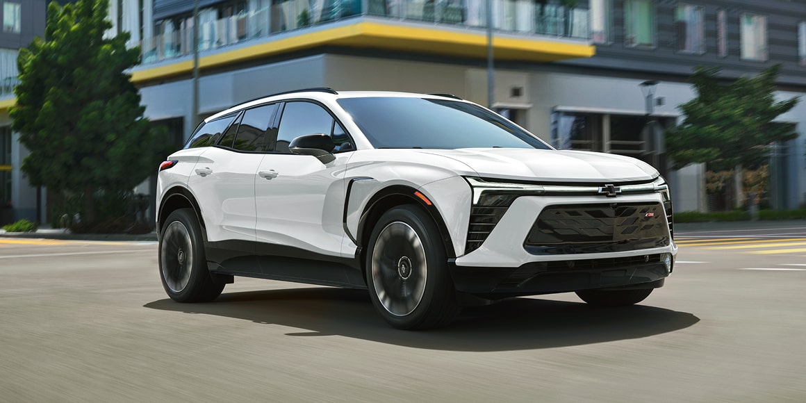 Chevy Blazer EV Driving Through an Intersection Downtown