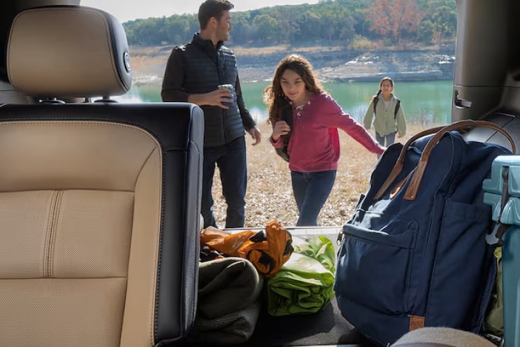 Family outside with SUV