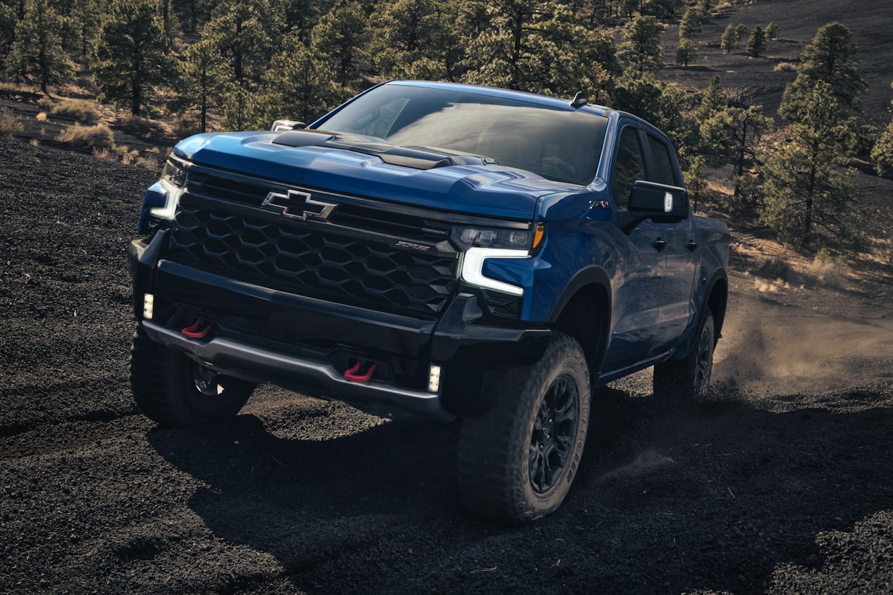 Font Shot of Blue Silverado ZR2 Driving Quickly on Off-Road Terrain